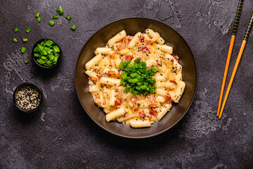 Spicy Rice Cake with Cheese and Bacon or Cream Teokbokki, Tteokbokki.