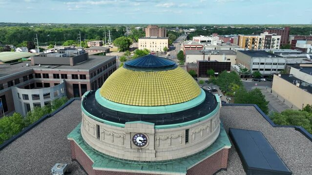 Stearns County Courthouse dome in Saint Cloud, Minnesota. Aerial orbit around local government building on summer day.