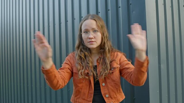 Young Woman Emphatically Declining with Expressive Gestures. Refusal Expression 