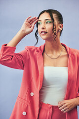 Woman, thinking and fashion with gen z style and trendy clothes with cosmetics. Studio, blue background and intern with makeup and confidence with stylish suit for internship and classy clothing