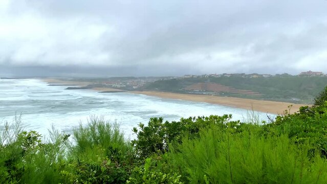 View of the Sables d'Or and Chambre d'Amour beaches in Anglet, France on a bad weather day