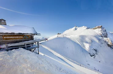 Foto op Canvas Courchevel ski slopes view from top gondola station.  © borisbelenky