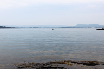 The front view in the cloudy sky is bright blue with clear white clouds. And the sea deep indigo in...