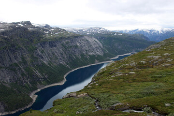 Fototapeta na wymiar Trail to Trolltunga nature attraction. Beutifull view of fjord and mountain Wild pristine nature background.