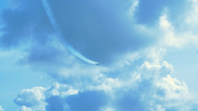 F-16 Fighting Falcon fighter jet high speed flypast with multiple rolls and high G pull up, Baltic International airshow, handheld 4k shot