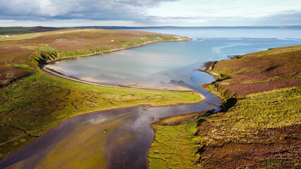 Aerial shot of Waulkmill Bay, Orkney at high tide