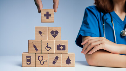 Fototapeta na wymiar Concept of Insurance for your health, Hand hold wooden block with icon healthcare medical
