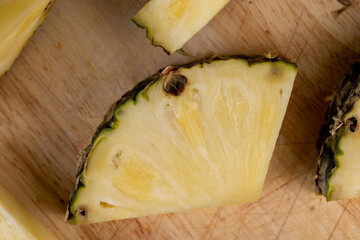 sliced ripe yellow pineapple, a large number of pieces