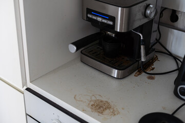 Dirty coffee machine metal background with unwashed surface. Coffee machine has not been cleaned. Cafe equipment maintenance.