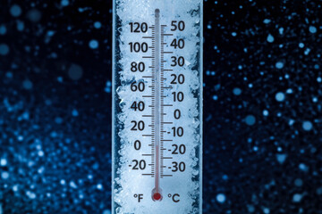 A frozen thermometer showing exactly zero degrees Fahrenheit
