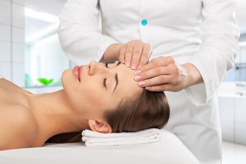 Obraz na płótnie Canvas Beautiful young Woman Enjoying Massage In Salon, AI generated image