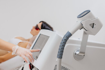 Hair removal-depilation. A young woman undergoes a laser hair removal procedure, close-up. Dermatology, photorejuvenation. Cosmetic clinic. Laser hair removal.