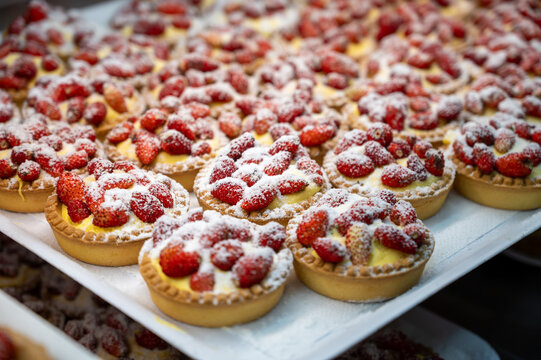 Wild fragolino strawberry and raspberry cakes in ancient city of strawberry Nemi, Castelli Romani, Italy close up