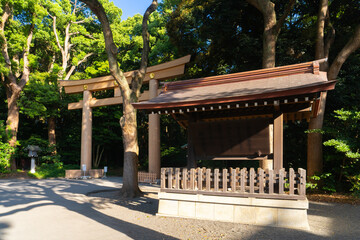 Fototapeta na wymiar Torii gate at the entrance of Meiji Jingu Shrine, Shibuya, Tokyo