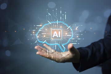 Businessman holding brain of artificial intelligence ai to apply in content creator or creative assistance by big data technology machine learning on natural language processing NLP.