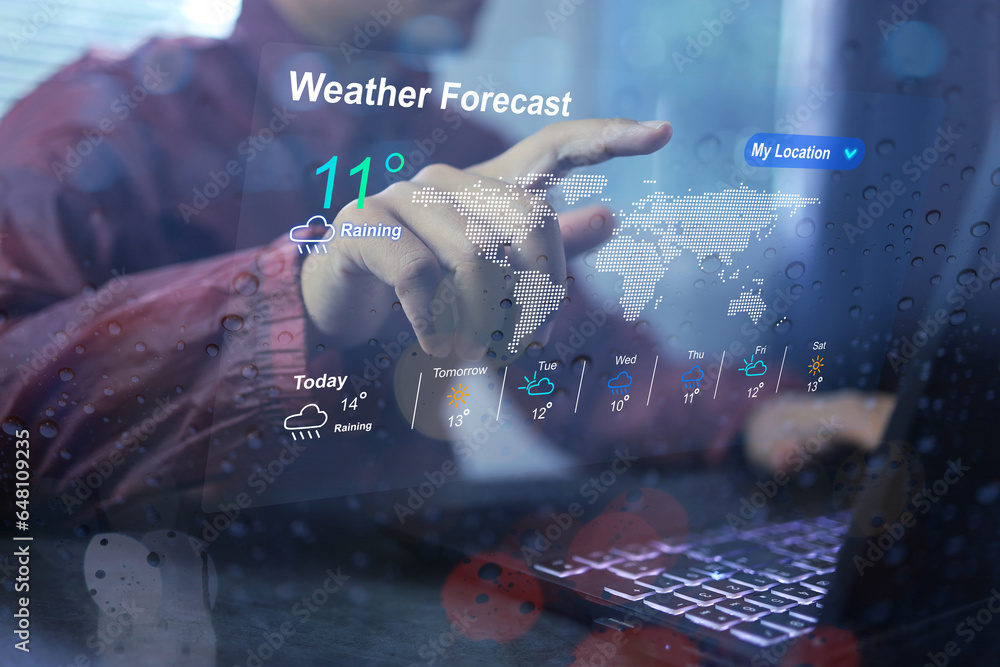 Wall mural man wearing rain coat using application weather forecast before going out home checking weather with
