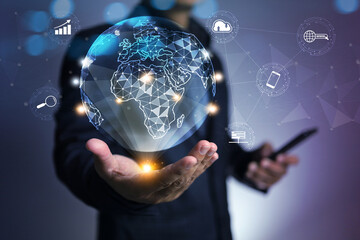 Businessman holding world globe in hologram to connection with no boundary communication information transfer cloud technology website server device search engine to support business activity - obrazy, fototapety, plakaty