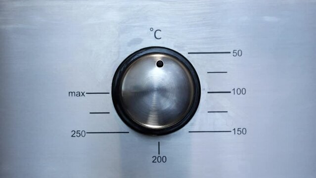 Man Turns Down The Oven Temperature From 150 Degrees Celsius