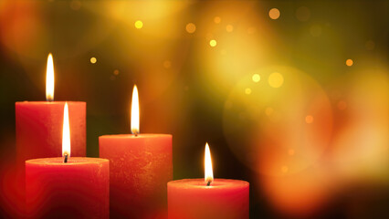 four red burning candles with shiny flames on bright abstract blurred background with space for...