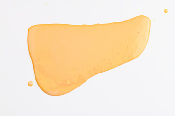 Acrylic paint blot, chaotic brushstroke, spot flowing on white paper background. Creative yellow color backdrop, fluid art.