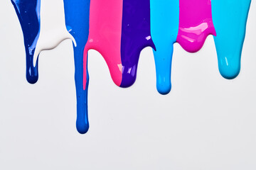 Acrylic multicolor paint blot, chaotic brushstroke, spot flowing on white paper background. Creative blue color backdrop, fluid art.