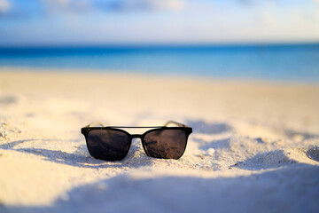 Holiday and Relaxation - Sunglasses at the Beach - obrazy, fototapety, plakaty