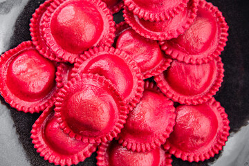 ravioli beet dye pasta red color cooking appetizer meal food snack on the table copy space food background rustic top view