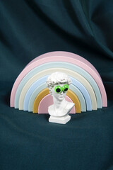 bust of David with fake bulging eyes and rainbow