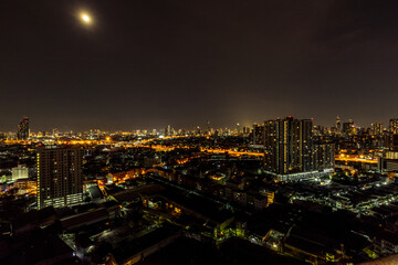 Fototapeta na wymiar Panorama background of city views, high-rise buildings (condominiums, offices, housing estates, expressways) and many connecting roads, blown through the blur