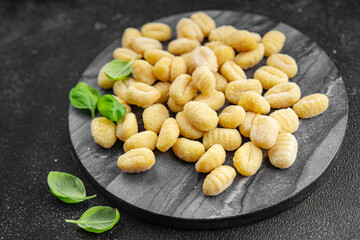 gnocchi raw potato food second course cooking appetizer meal food snack on the table copy space food background rustic top view keto or paleo diet