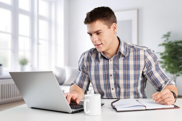 Young businessman using a computer in office,
