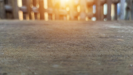 selective focus Weathered wooden table top with rough texture with dry bamboo fence background with...