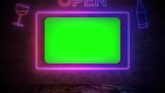 4K Monitor with green screen on dark brick wall and neon backlight. Retro neon signage on brick. Neon led sign 