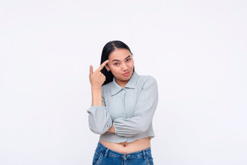 A young and bitchy asian woman pointing to her temple. Looking at someone telling them she is aware...