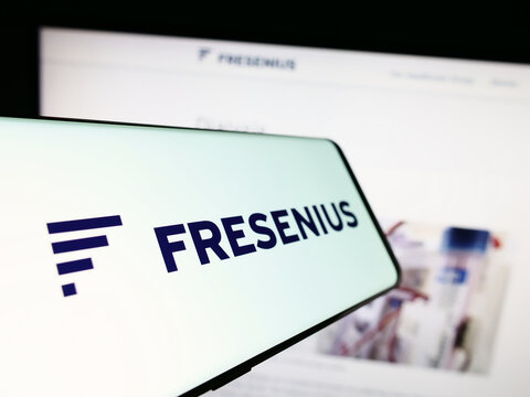 Stuttgart, Germany - 09-11-2023: Smartphone with logo of German healthcare company Fresenius SE Co. KGaA on screen in front of website. Focus on center-left of phone display.