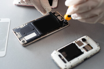 Close-up photos showing process of mobile phone repair