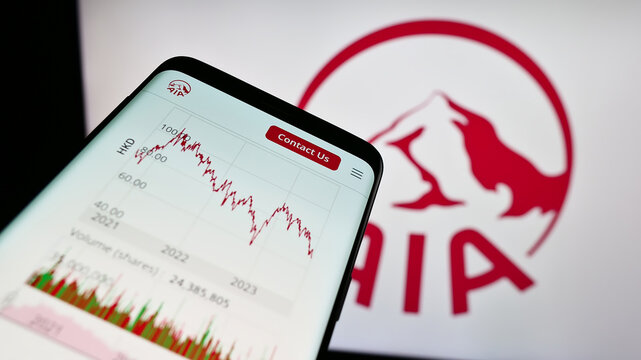 Stuttgart, Germany - 09-13-2023: Smartphone with webpage of insurance company AIA Group Limited on screen in front of business logo. Focus on top-left of phone display.