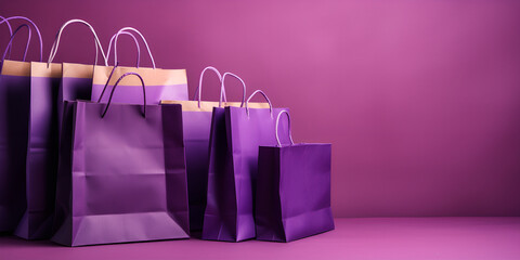 Multicolored paper shopping bags. Christmas shopping banner ,colorful empty shopping bags purple background