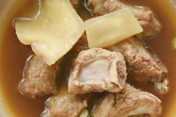 boiled braised pork bone with Chinese herb stew soup on bowl
