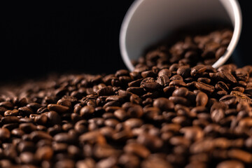cup of coffee bean on brown cofee background.