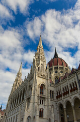 Classic wide-angle view of The Hungarian Parliament Building against colorful dramatic sky. Famous touristic place and travel destination in Budapest, Hungary