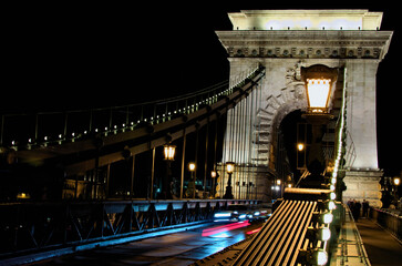 Picturesque view of ancient illuminated Chain Bridge over Danube river. Notable landmark of Budapest. Travel and tourism concept