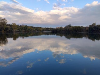 Crepuscular light at sunrise on the lake 
