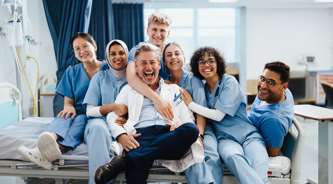 Celebrating a successful medical team: Health students pose for the camera with their supervising doctor