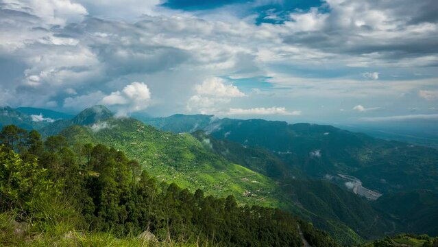 Timelapse of moving clouds and a river from chota kailash, uttarakhand
