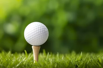 Fotobehang White golf ball on wooden tee with grass. © MstAsma