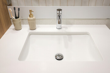 Chrome faucet and granite sink in the bathroom