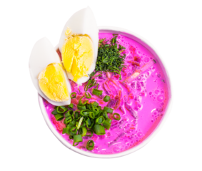 Beetroot soup, holodnik. one of the traditional dishes of Belarusian cuisine. Soup made on the basis of kefir with beetroot. Top view. Beetroot soup and cut boiled egg with spring onions. Clipping