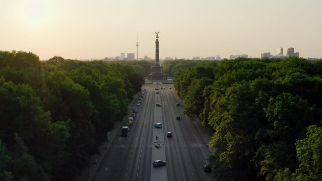 Establishing Aerial shot of Berlin Skyline, capital of Germany, European Union. Main touristic landmarks: Victory Column in green Tiergarten park and TV Tower. 4K drone zoom in urban cityscape
