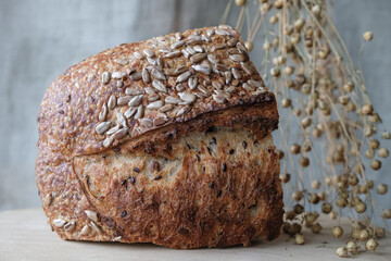 Multigrain bread. Flax seeds pods. Crust. Wholemeal flour. Sourdough bread.